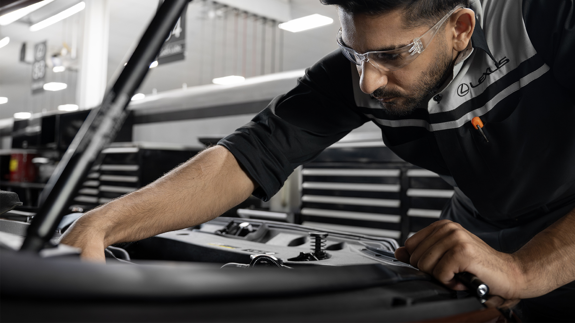 A mechanic working on a Lexus vehicle
