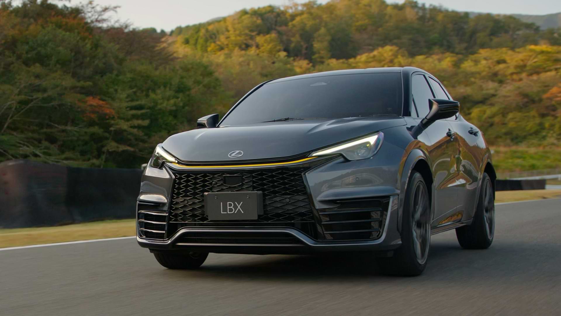 Black LBX Morizo RR concept vehicle driving with trees in the background