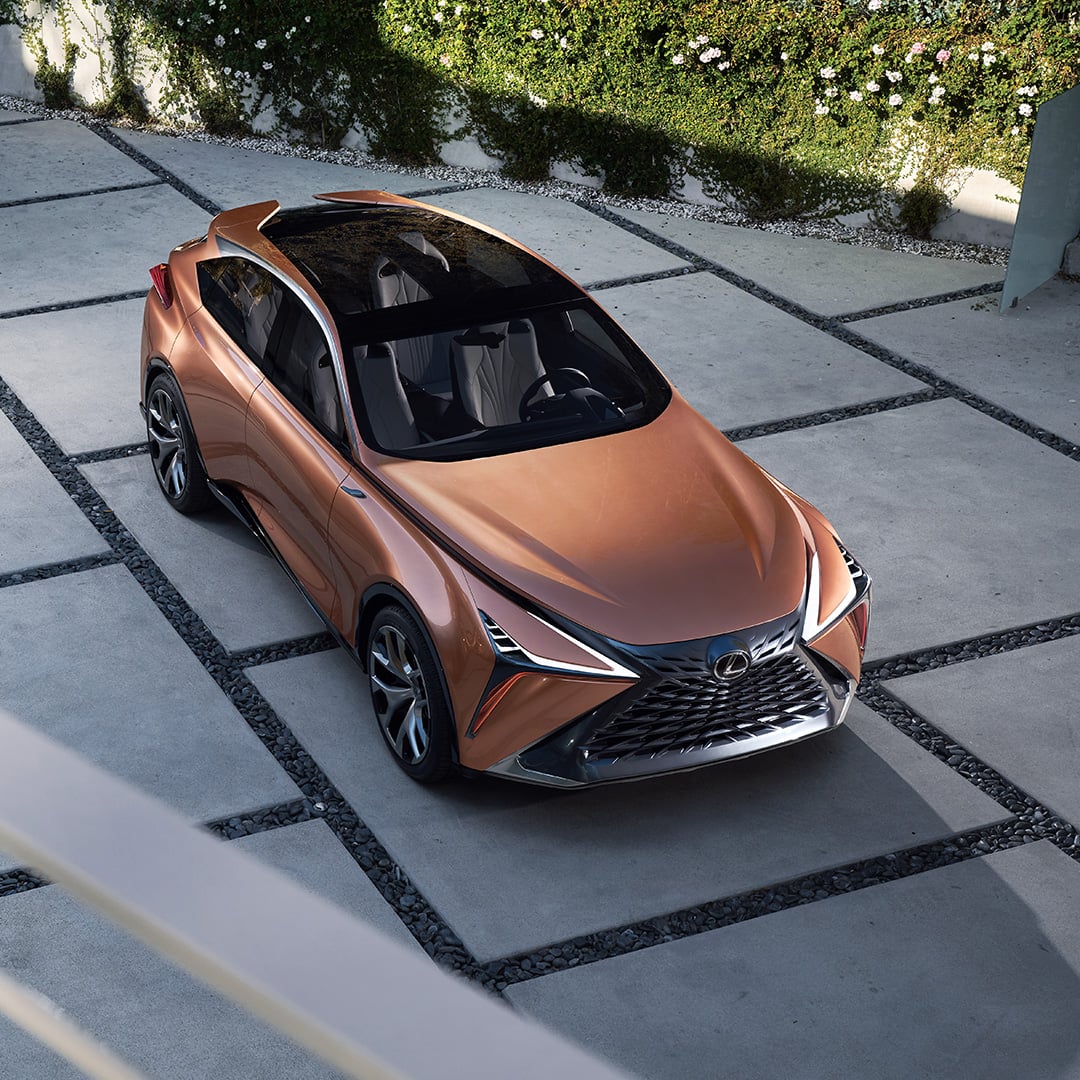 Copper Lexus LF-1 Limitless concept vehicle parked on a driveway viewed from above