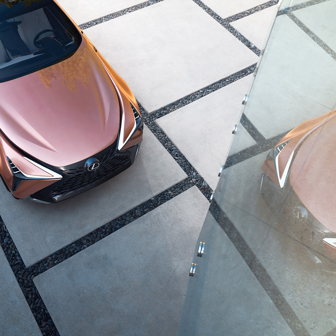 The bonnet of a copper Lexus LF-1 Limitless concept vehicle parked on a driveway