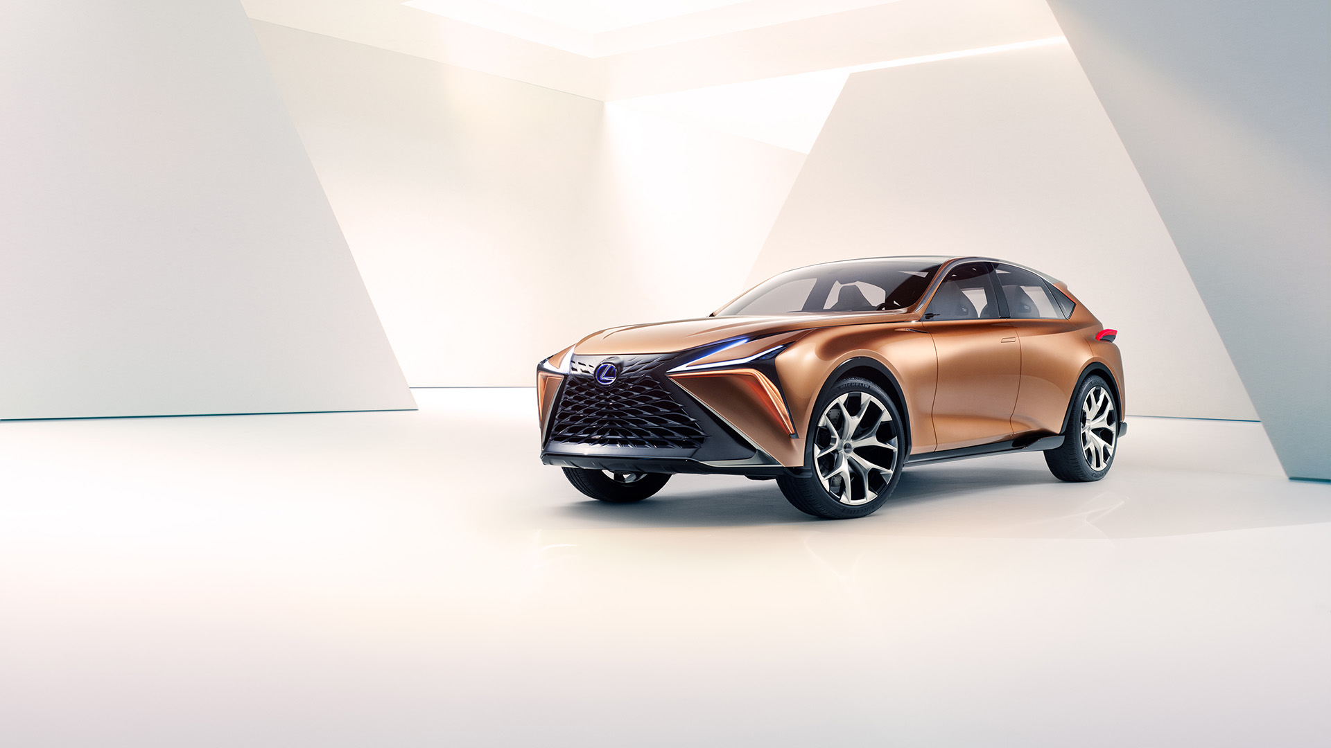 Copper Lexus LF-1 Limitless concept vehicle parked in a white room