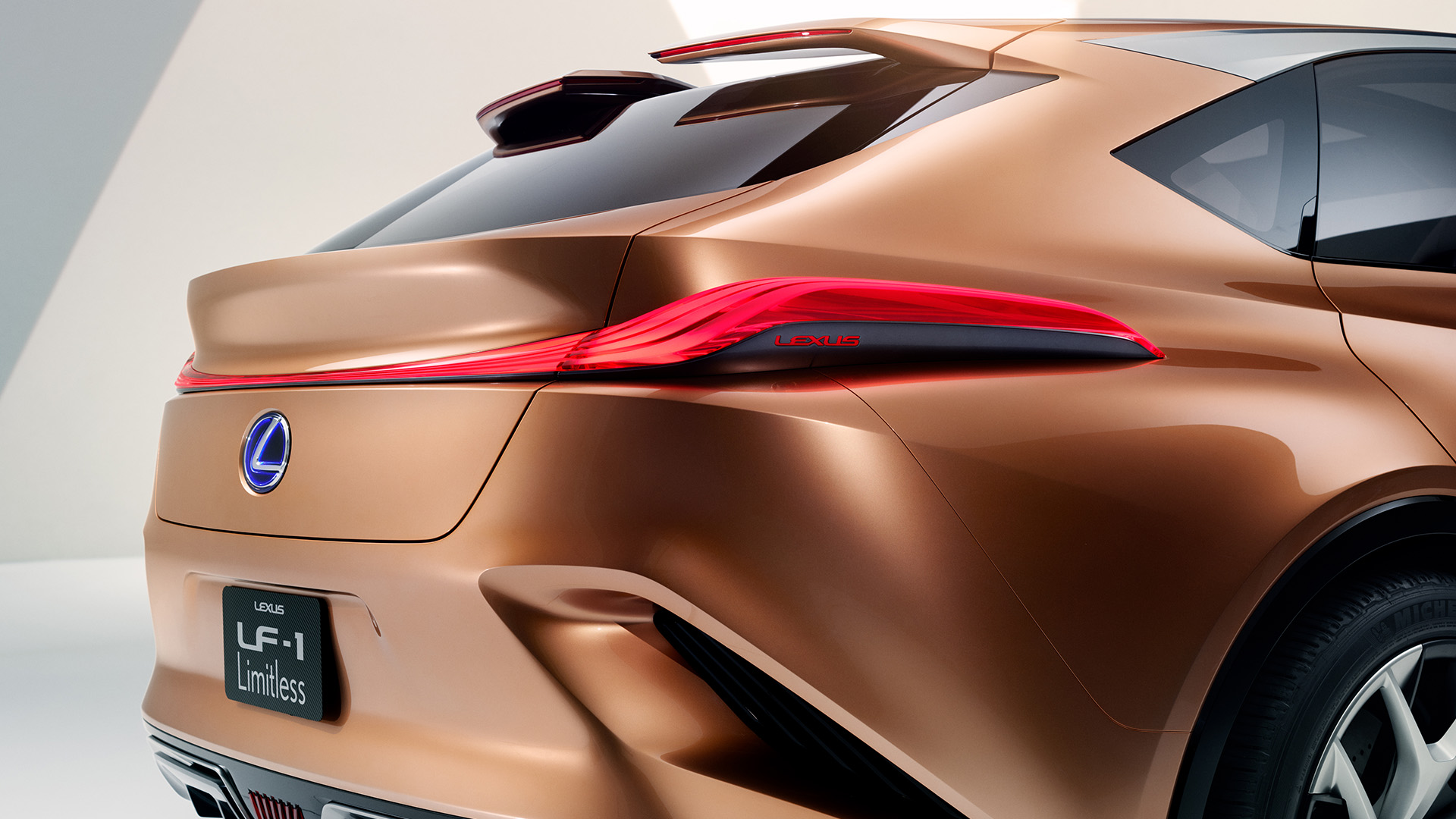 Rear view of the Lexus LF-1 Limitless concept vehicle in Copper colour.