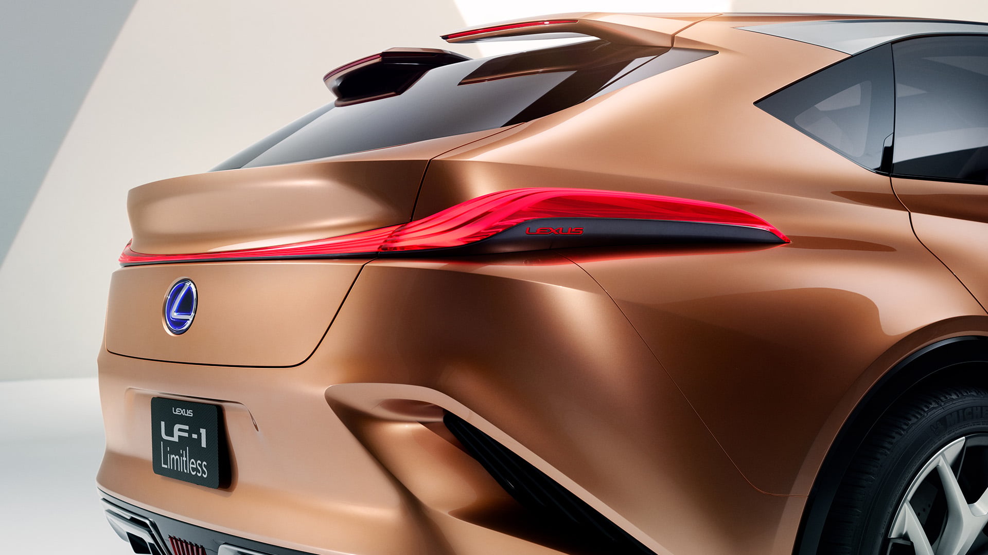 Rear view of the Lexus LF-1 Limitless concept vehicle in Copper colour.