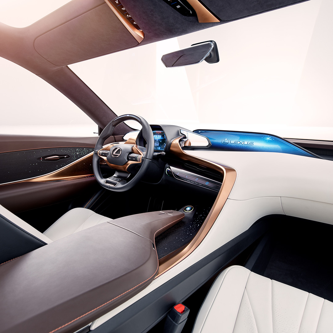 The interior cabin of the Lexus LF-1 Limitless concept vehicle in tan and black.