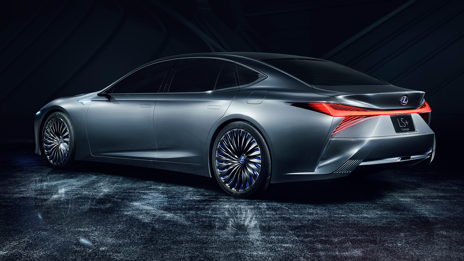 Lexus LS+ concept vehicle in a studio setting with red lights on