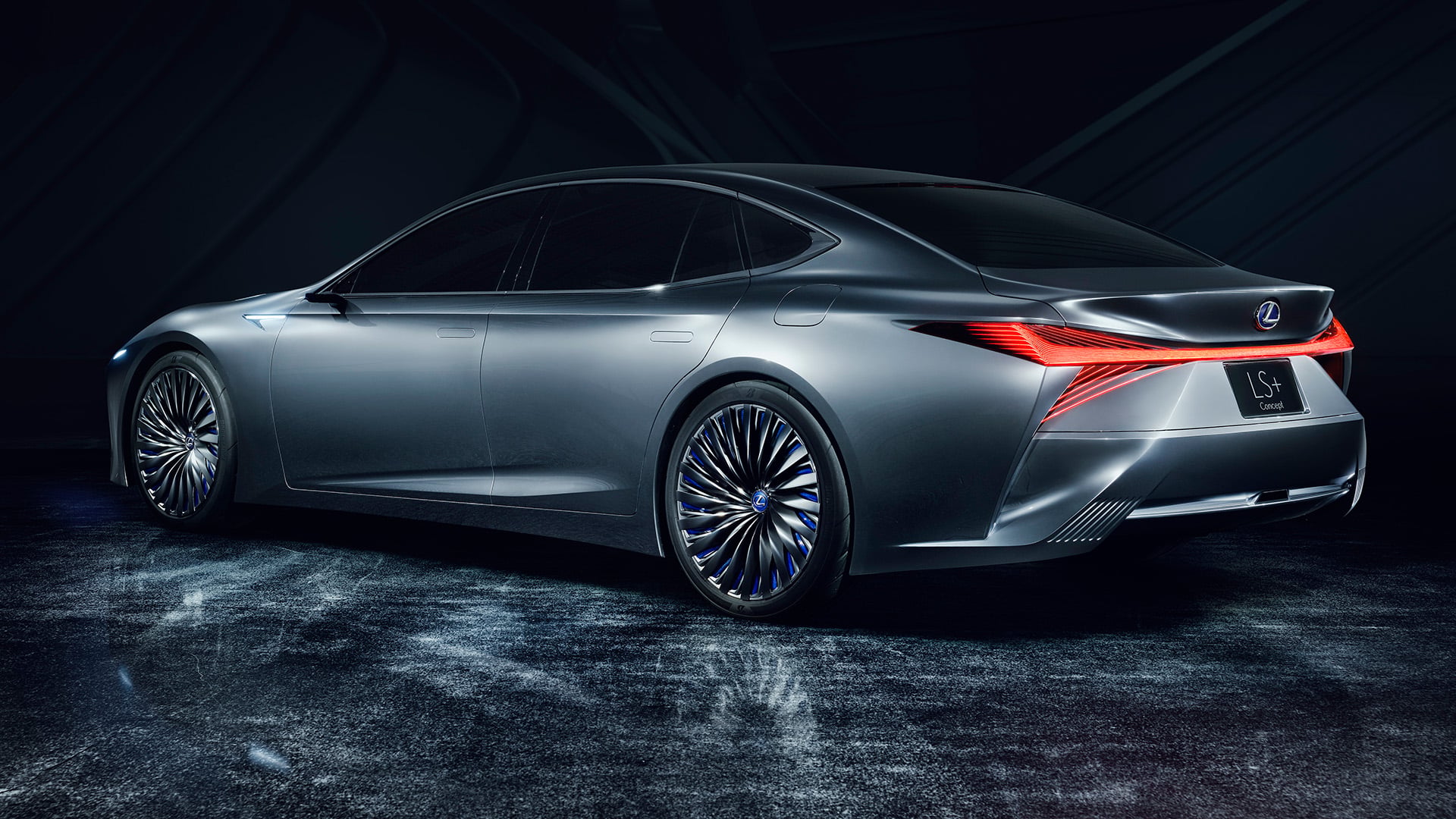 Lexus LS+ concept vehicle in a studio setting with red lights on