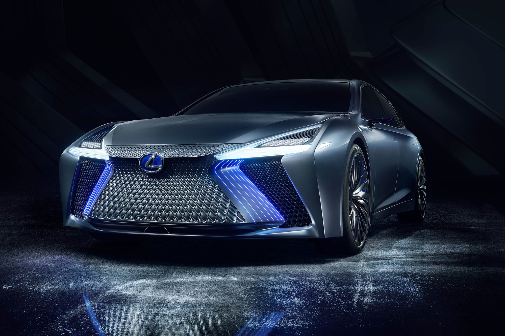 Front spindle grille view of the Lexus LS+ concept vehicle with blue lights on
