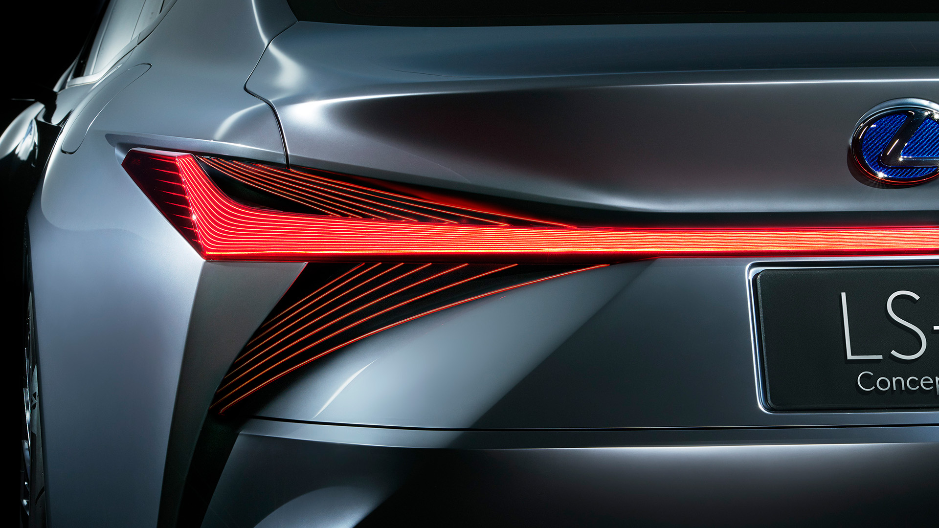 Close up of red rear lights on the Lexus LS+ concept vehicle in a studio setting