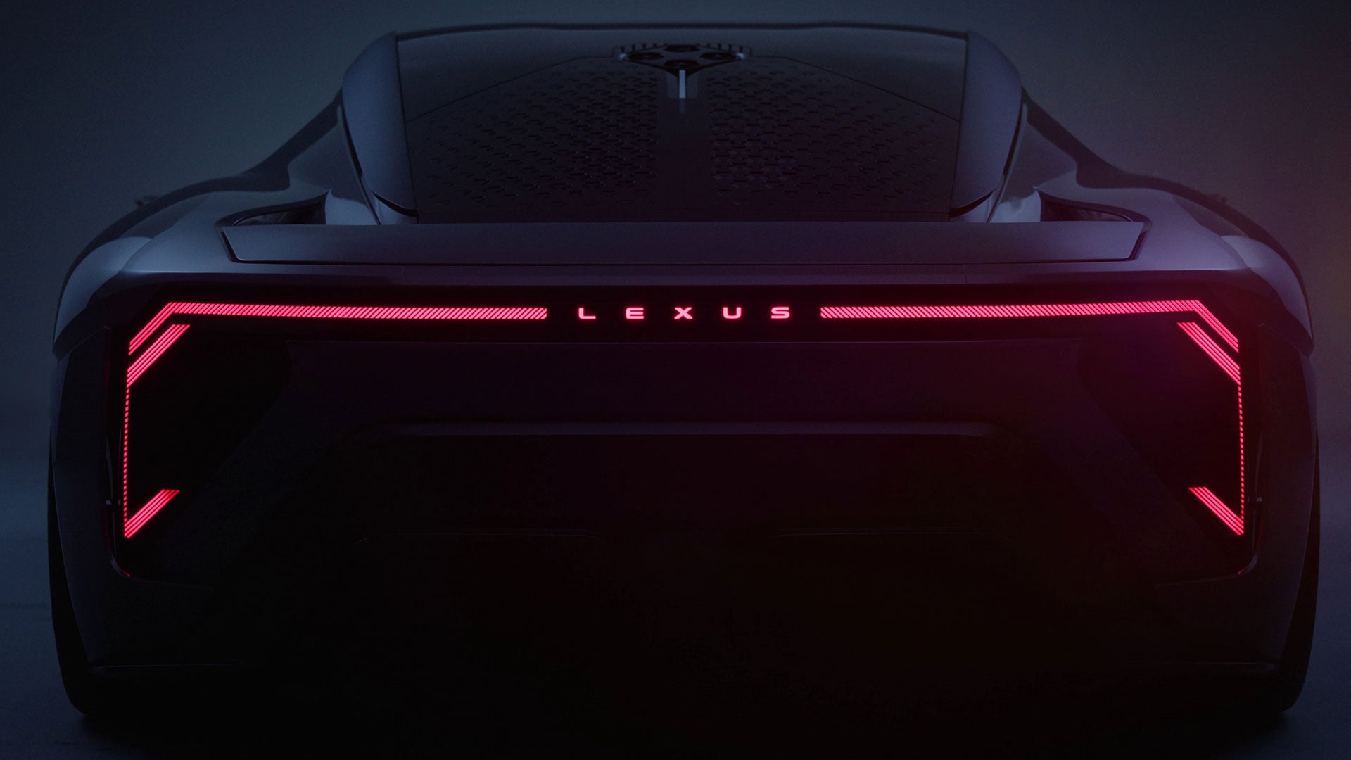 Rear view of the Lexus LFA Concept with illuminated Lexus lettering and full-width rear light bar