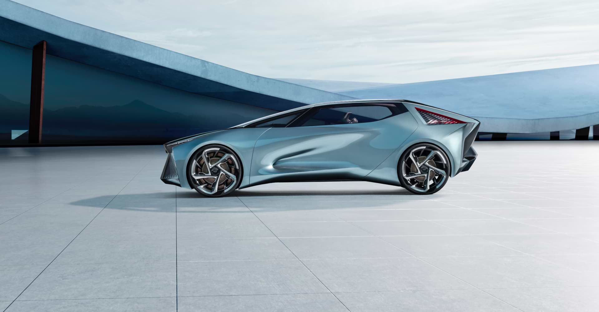 Lexus LF-30 Electrified Concept car, light blue, parked in front of modern building on pavers.